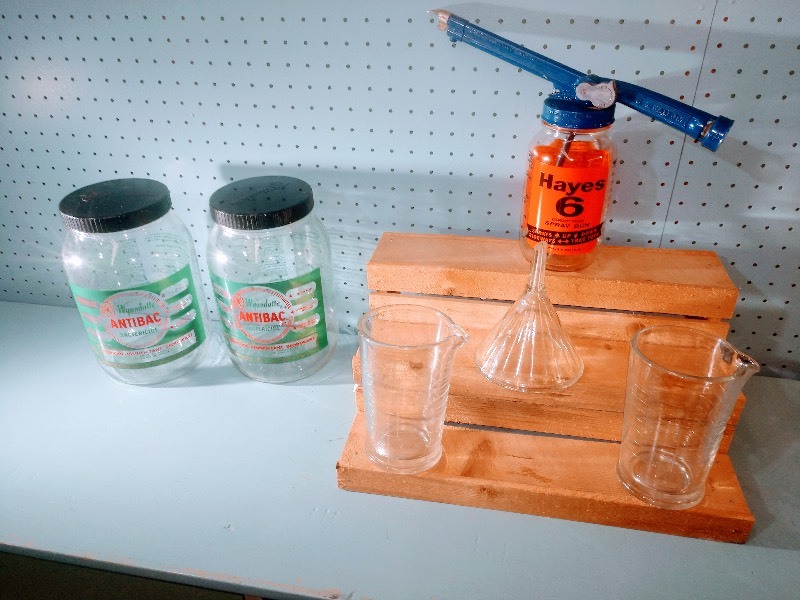 lot 51 image: Vintage Wyandotte Antibac Bactericide Jars (No contents) - Vintage Hayes Garden Hose Spray Gun - Vintage Mooney Airvent Funnel - Vintage Mooney Airvent Beaker