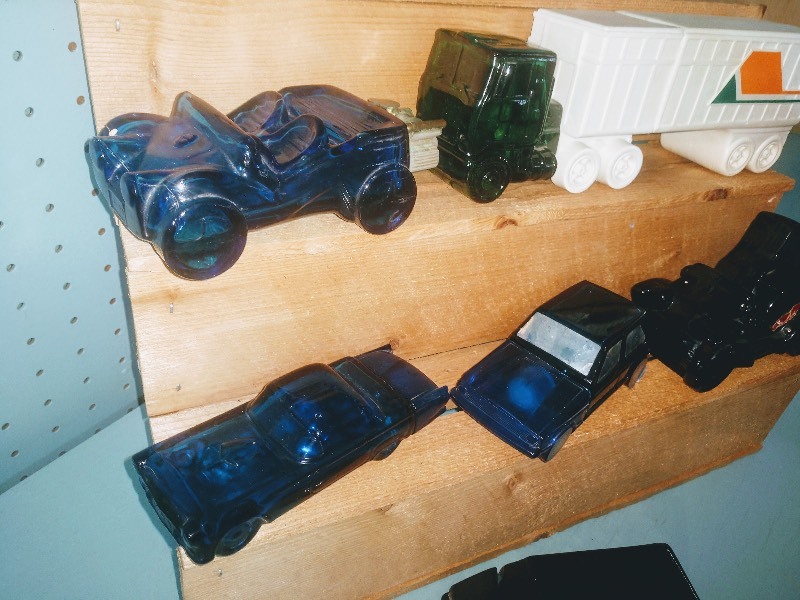 lot 84 image: Vintage Avon After Shave Bottles CA 1970s and 1980s. Dune Buggy - Electric Charger - 55 Thunderbird - Volkswagen Rabbit