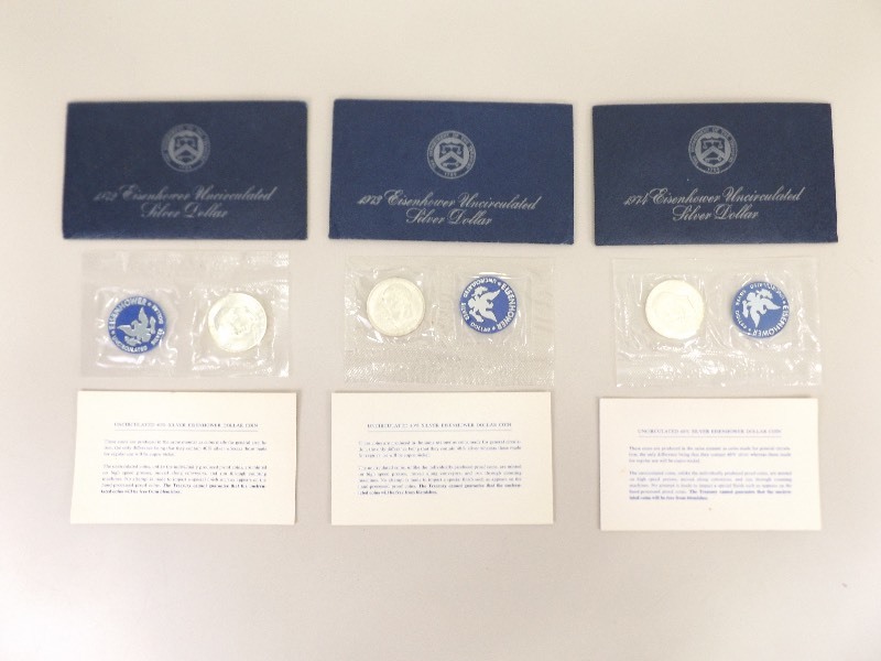 lot 15 image: 1972, 1973, 1974 Uncirculated Eisenhower Silver Dollars