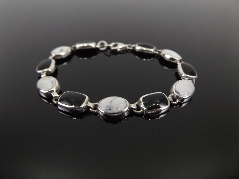 lot 70 image: .925 Sterling Silver Black Onyx and White Quartz Cabochon Bracelet
