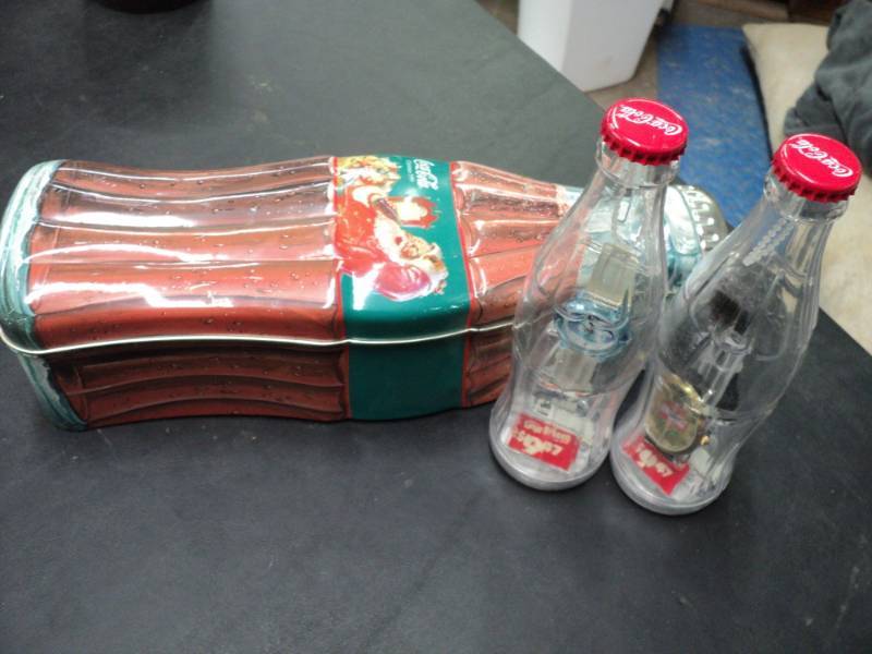 lot 115 image: Coca Cola Tin and 2 Watches in Coke...