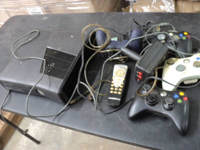 lot 175 image: Xbox 360 and controls...