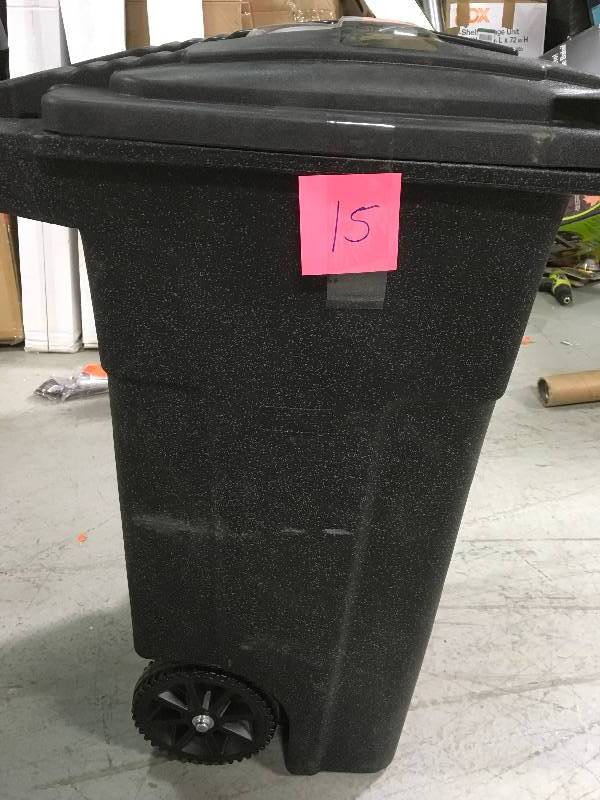lot 15 image: Toter 32 Gal. Blackstone Trash Can with Wheels and Attached Lid not used