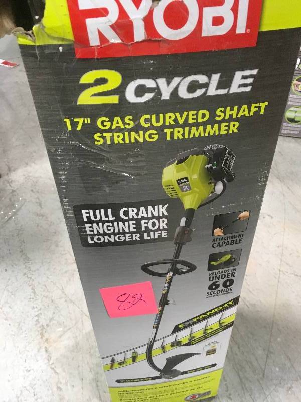 lot 82 image: RYOBI 25cc 2-Cycle Attachment Capable Full Crank Curved Shaft Gas String Trimmer in good condition