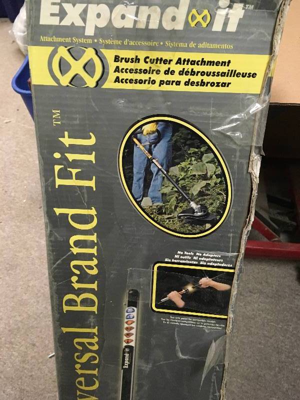 lot 63 image: RYOBI Expand-It 8 in. Brush-Cutter Trimmer Attachment in like new condition