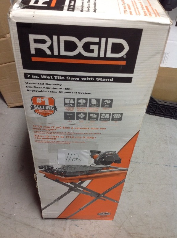 lot 112 image: RIDGID  7 in. Tile Saw with Stand  not used