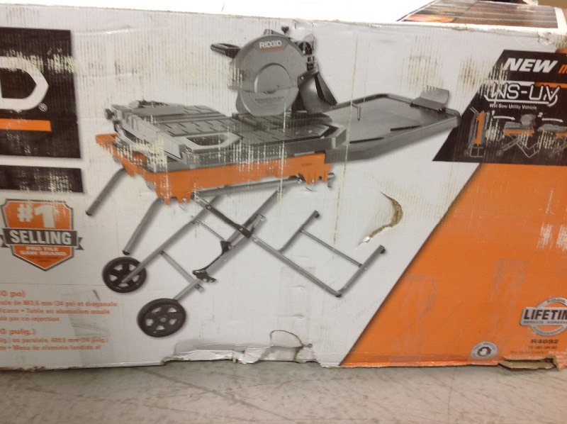 lot 105 image: RIDGID  10 in. Wet Tile Saw with Stand  in good conditions
