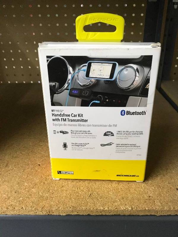 lot 141 image: Scosche Handsfree Car Kit With FM Transmitter, Retail $26.99