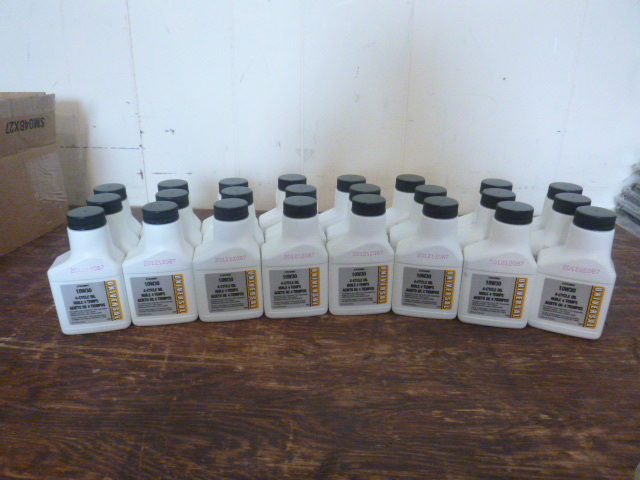 lot 70 image: 24 Bottles of Universal 10W30 4-Cycle Oil