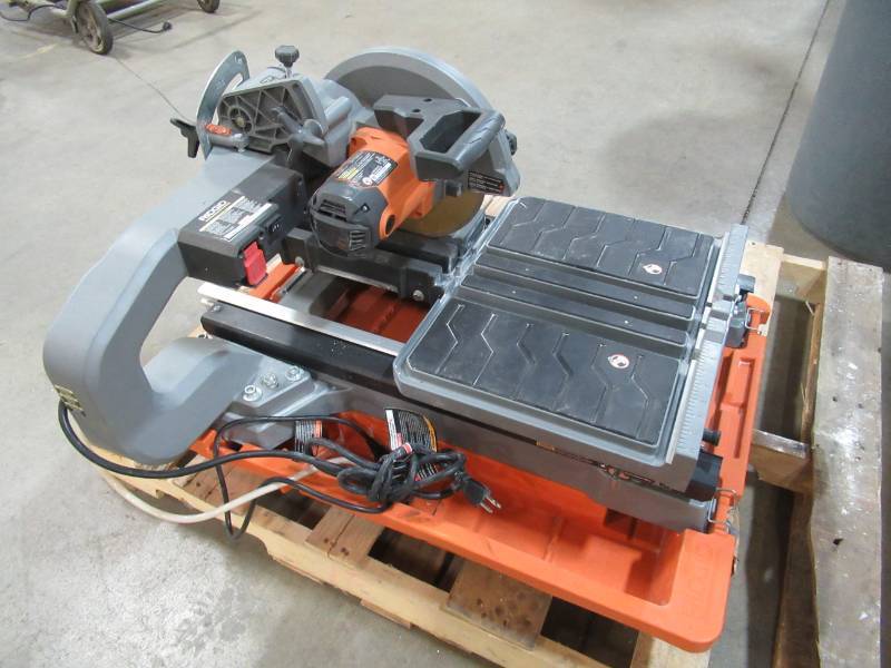 lot 62 image: RIDGID 10 in. Wet Tile Saw with Stand, R4092 - USED - NO STAND - BROKEN DRAIN PLUG