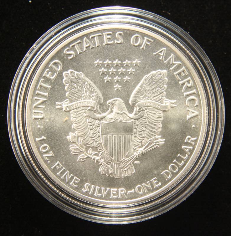 lot 28 image: 1987 AMERICAN SILVER EAGLE 1 TROY OZ. .999 FINE SILVER IN AIRTITE