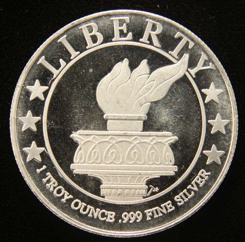 lot 42 image: 1 TROY OZ. .999 FINE SILVER STATUE OF LIBERTY DESIGN
