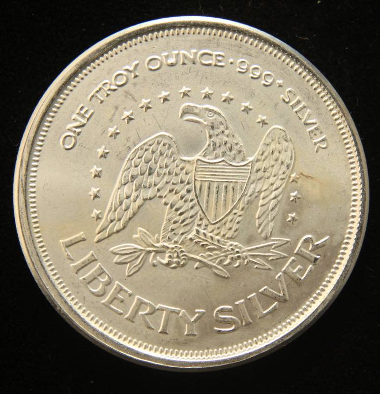 lot 53 image: 1 TROY OZ. .999 FINE SILVER A-MARK LIBERTY ROUND
