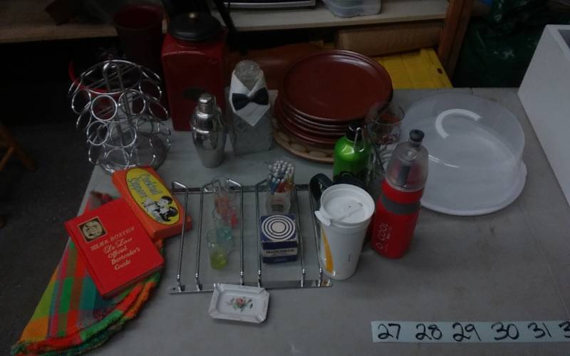 lot 27 image: Keurig Cup Carousel, Under Cabinet Stemware, 6-Stoneware Plates, 1-Platter, Bar Ware & Kitchen Misc