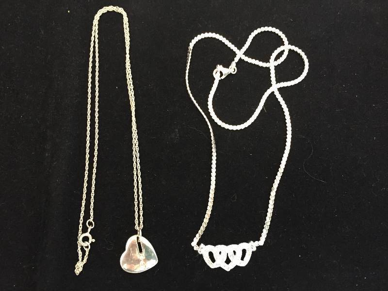 lot 139 image: 2 Sterling Silver Heart Necklaces - one with Diamond Accents
