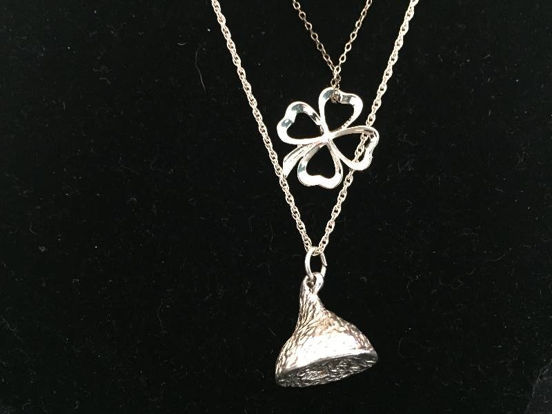 lot 77 image: 2 Sterling Silver Necklaces -  4 Leaf Clover & Hersheys Kiss