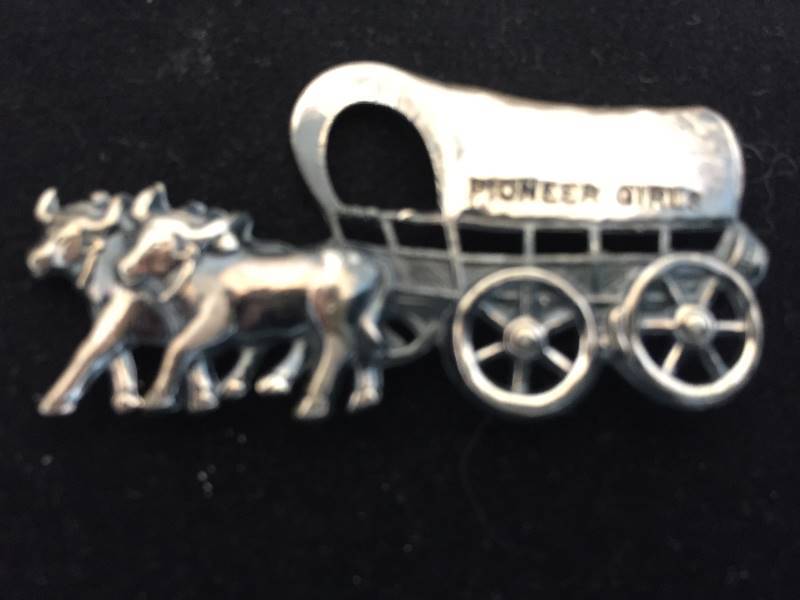 lot 147 image: Sterling Silver Pioneer Girl Stagecoach Pin  Brooch
