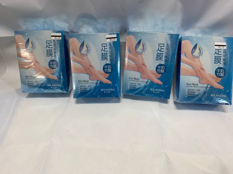 lot 40 image: 4 Boxes Milk & Bamboo Feet Masks ($100 retail)