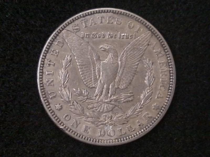 lot 14 image: 1899 Morgan Silver Dollar (appears ...