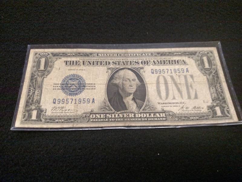 lot 139 image: 1928 A Funny Back One Dollar Silver...