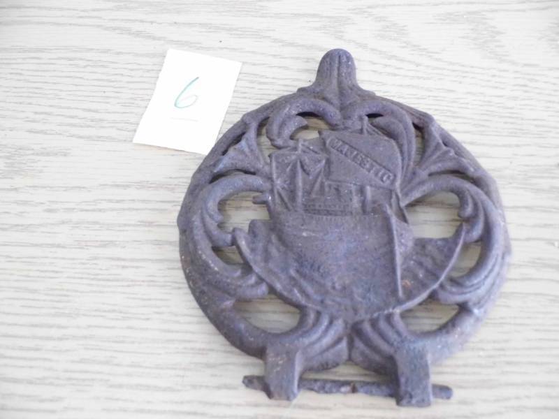 lot 6 image: Cast Iron Piece from Majestic Stove