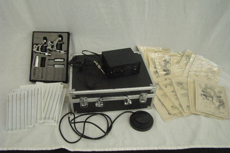 lot 86 image: Beginner Tattoo Kit with 2 Guns Shader Liner Needles and 16 Practice Skins 