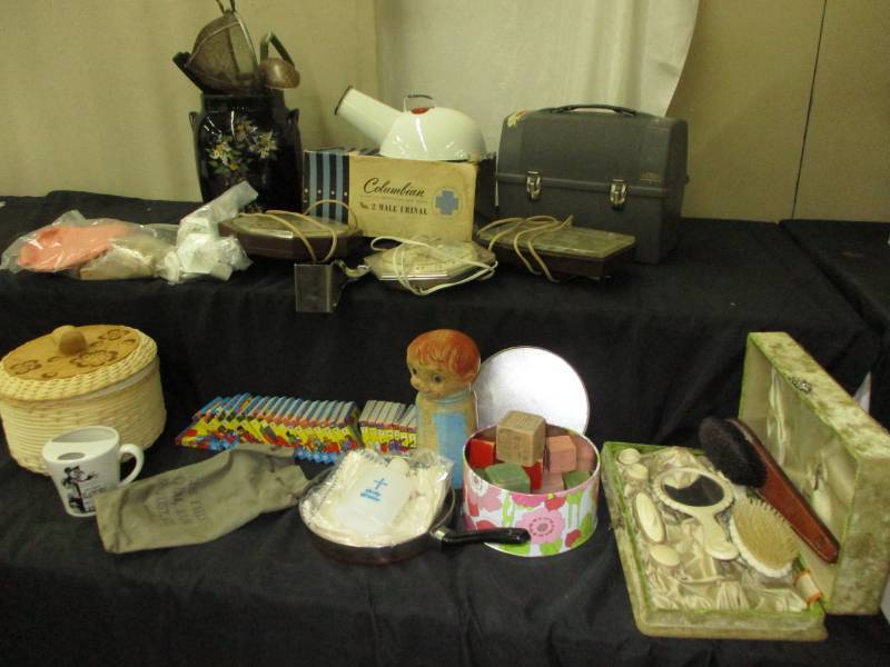 lot 49 image: Crock, utinsils, peppy squeeker, blocks, clocks, lunchbox, Mens Urinal