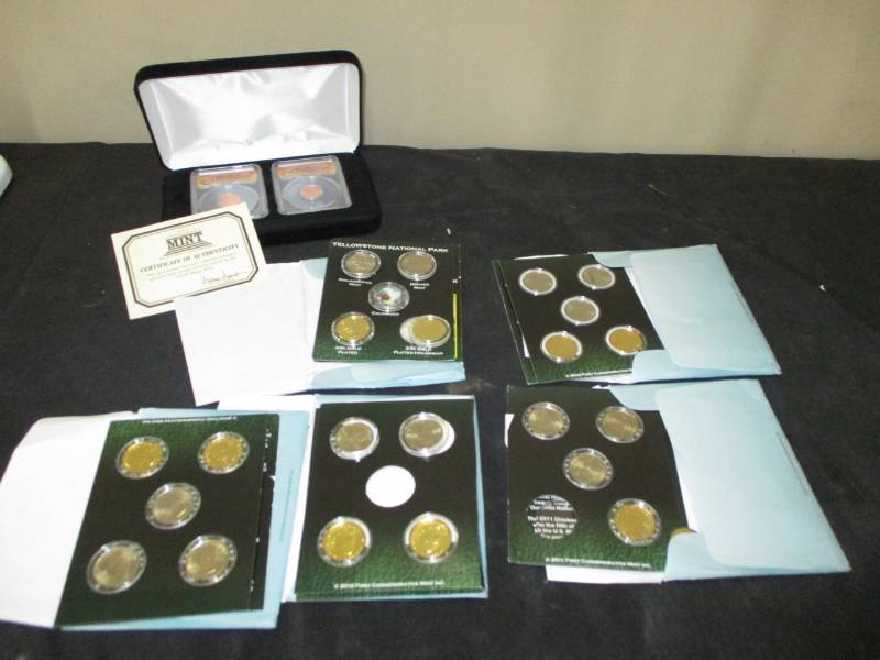 lot 101 image: 2011, 2012,  American Quarter Sets and  3-2010 Quarter Sets First Commemorative pennies