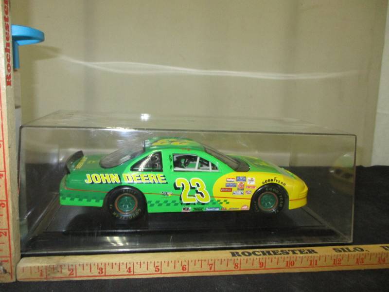 lot 102 image: John Deere #23 Diecast Car In a display Box