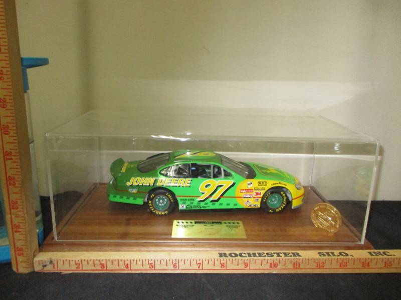 lot 103 image: John Deere 1998  #1146 signed by driver and collector coin ( #97 Diecast Car In a display Box)