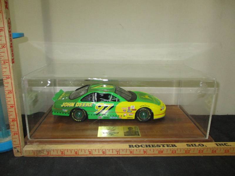 lot 104 image: John Deere1997  #05338 signed by driver Diecast Car In a display Box