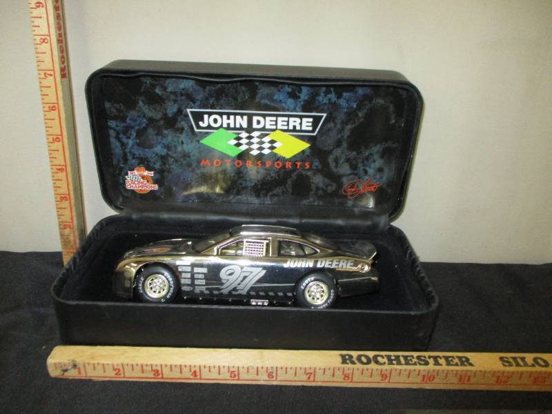 lot 117 image: 10 year Racing Champions John Deere Motorsports Car Platinum Diecast Car in leather Like Flip Open Box and Certificate Card