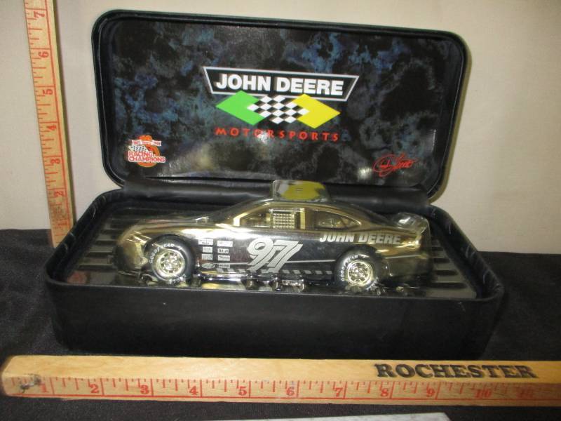lot 118 image: 10 year Racing Champions John Deere Motorsports Car Platinum Diecast Car in leather Like Flip Open Box and Certificate Card