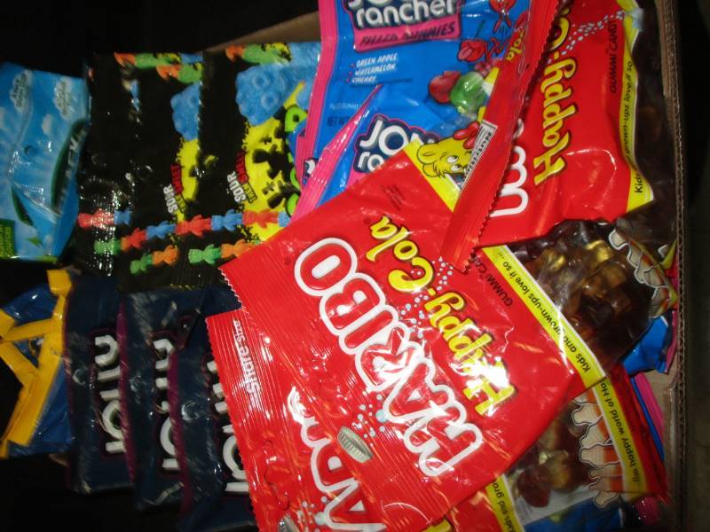 lot 135 image: 26 bags jolly ranchers, sour patch bags full and more