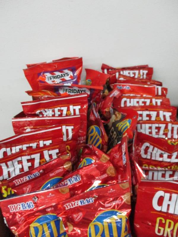 lot 134 image: cheezits, ritz and bags and bags of snacks
