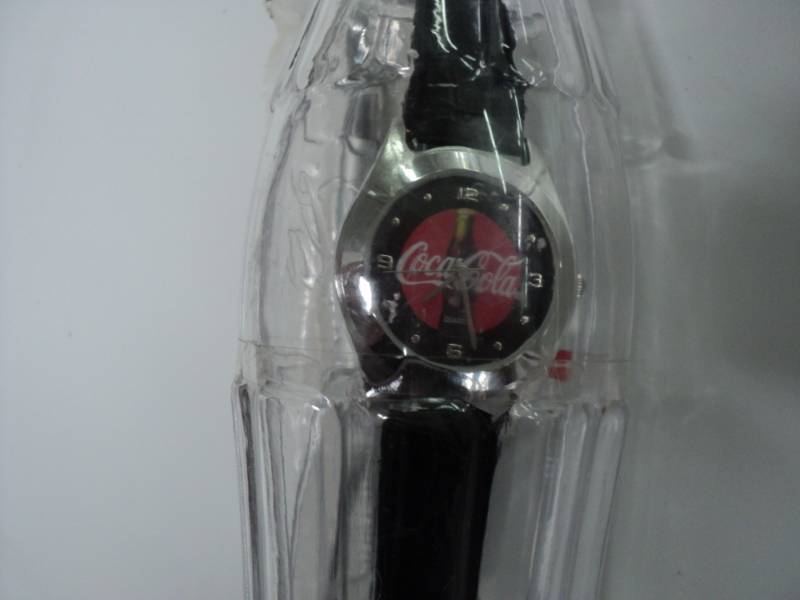 lot 69 image: Coca Cola Watch in a Bottle...