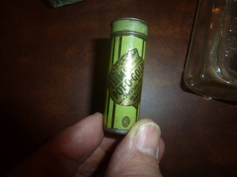 lot 121 image: Item # 66 Antique  Tums Pill Bottle