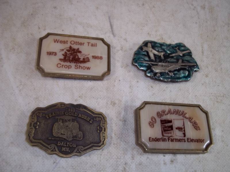 Dalton, Enderlin, Ottertail and planes belt buckles