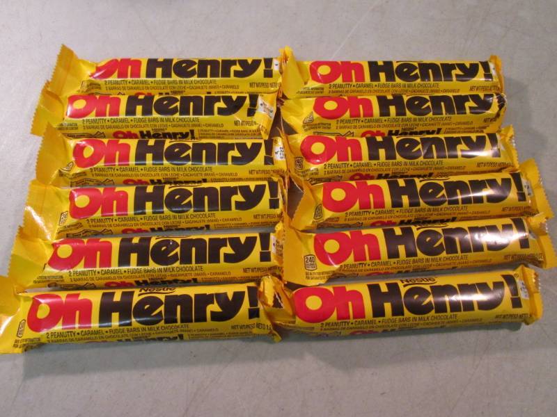 lot 218 image: 12 Oh Henry Candy Bars Best by Oct...