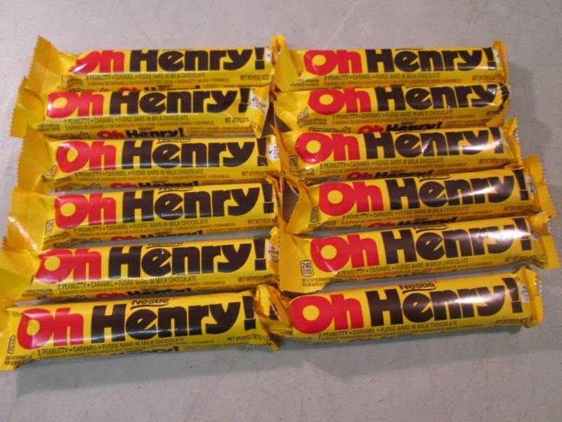 lot 219 image: 12 Oh Henry Candy Bars Best by Oct...