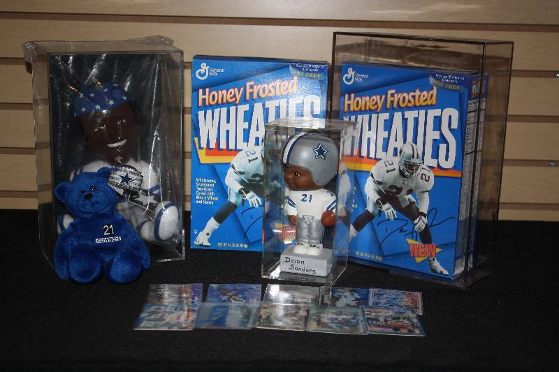 lot 104 image: Lot of 15 Deion Sanders Cards and Collectibles