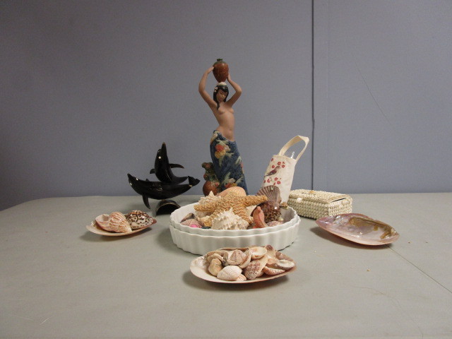 lot 687 image: NADAL POLYNESIAN SCULPTURE, SHELLS AND TUSK DOLPHINS