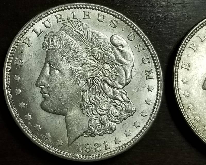 lot 52-A image: 2 AU-UNC 1921 MORGAN SILVER DOLLARS
