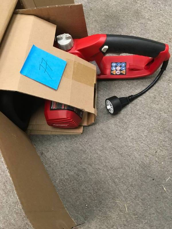 lot 77 image: Homelite 14 in. 9 Amp Electric Chainsaw in good working condition