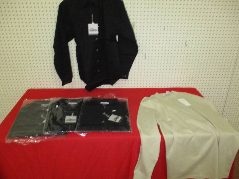 4 Size XLargel Ladies Shirts new in Plastic. One on hanger is a display