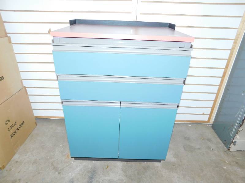 Turquoise Medical Storage Unit With Two Drawers & Two Doors With One Shelf Behind Them