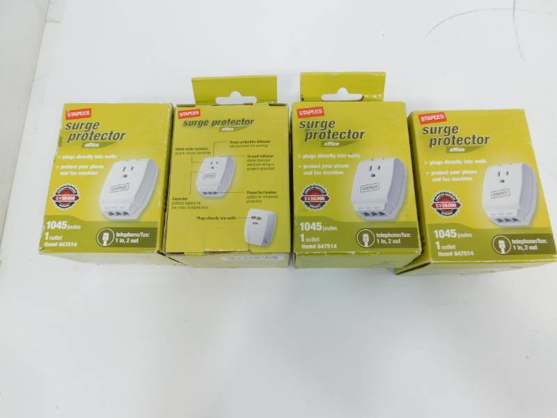 Four Staples Surge Protectors