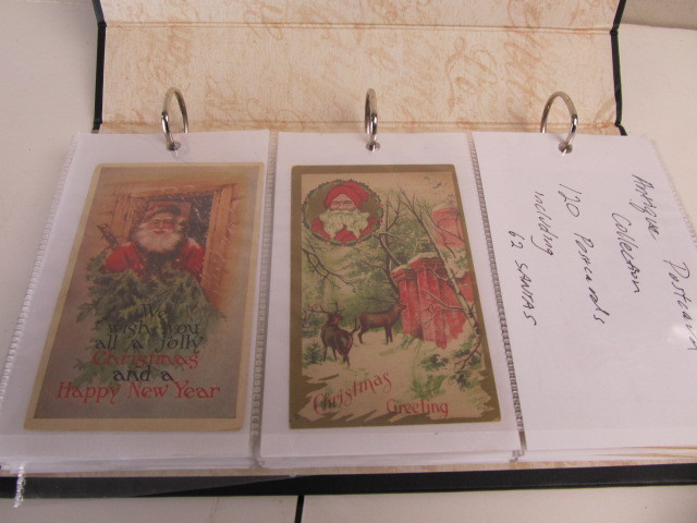 lot 145 image: Album FULL of Antique Christmas Postcards - Including 62 Different Santa Clause Cards