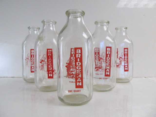 lot 168 image: Group of Vintage BRIDGEMAN Advertising Milk Bottles - 1 Quart