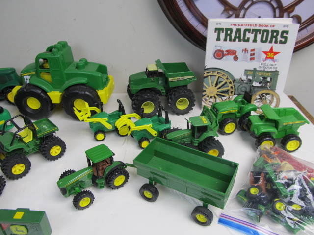 lot 97 image: Large Lot of JOHN DEERE Toy Tractors & Book